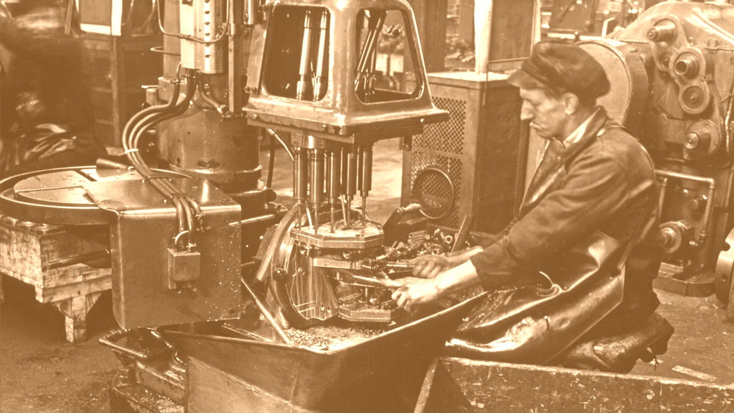 Sepia image of an old factory worker