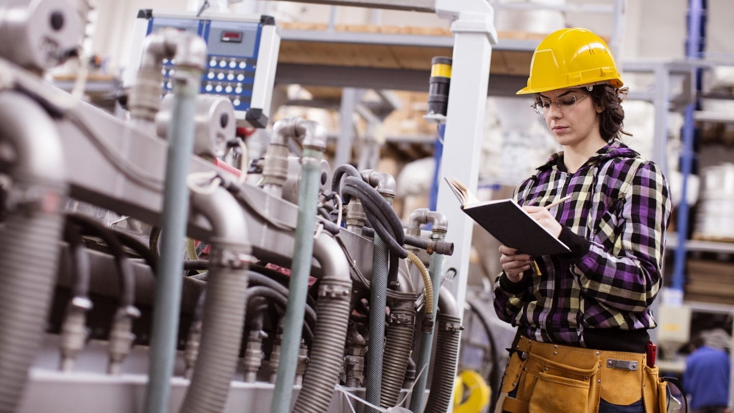 Engineer inspecting boiler equipment