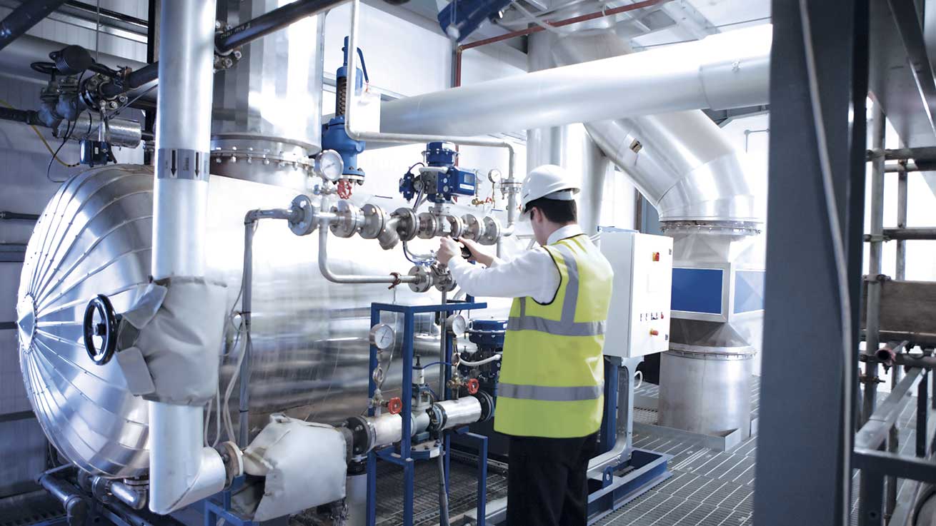 Engineer looking at boiler