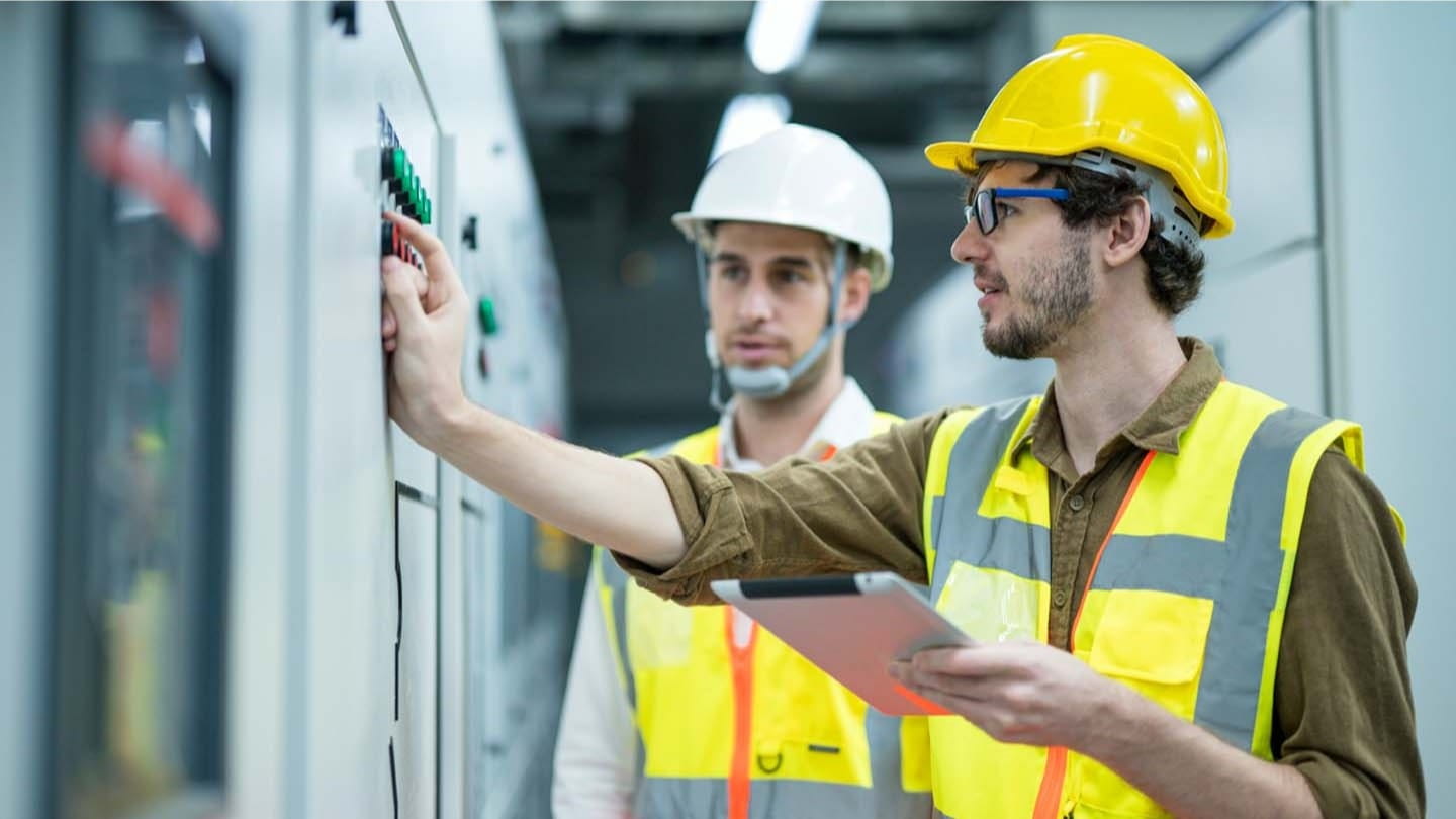Engineers looking at clipboard